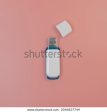 White usb flash stick with lid. On a pink background. Close-up, top view. Square format