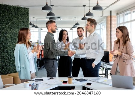 handshake business partners agree to sign contract. International trade,contract investment in meetings vision to invest for profit. side view on nice pleasant business people having successful job