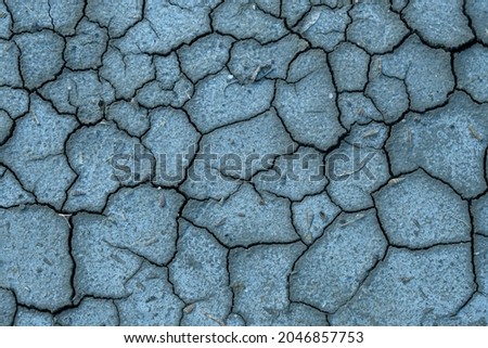 Dry water causes large cracks in the soil.