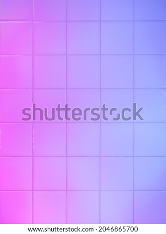 Bathroom tiles wall painted with blue and pink led light Royalty-Free Stock Photo #2046865700