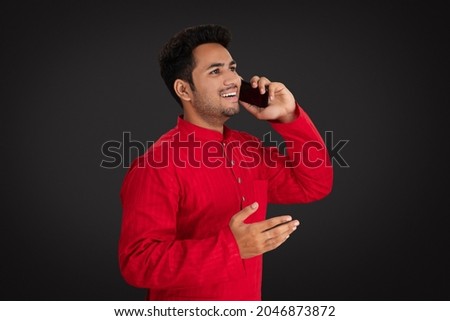 Happy man talking on phone during festive season
