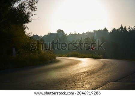 Picture of empty countryside road with forest