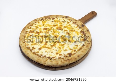 A closeup shot of a tasty cheesy pizza on a wooden board isolated on white background