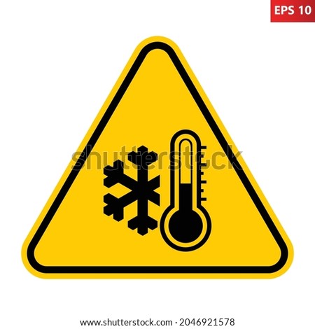 Low temperature warning sign. Vector illustration of yellow triangle sign with snowflake and thermometer icon inside. Very cold and freezing. Caution symbol isolated on background. Winter concept. Royalty-Free Stock Photo #2046921578