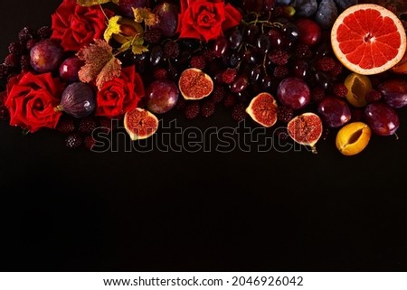 Autumn background still life of colorful fruits and flowers in the form of a gradient. Place for your text.