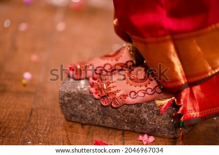 Mehndi design on a brides feet on the occasion of marriage.