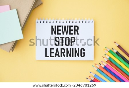 Text sign showing Never Stop Learning. Conceptual photo keep on studying gaining new knowledge or materials Notebook and writing equipment with computer mouse above pastel backdrop.