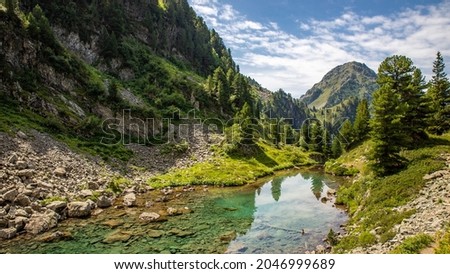 landscape photography of lake leana in the belledonne massif (alps, chamrousse, france) during a family hike in summer