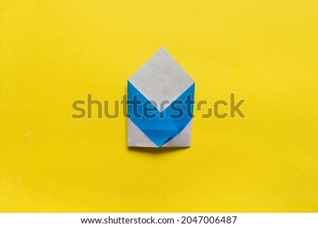 Step by step photo instruction how to make origami paper penguin. Simple diy kids children's concept. Step 1.