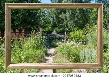 A high angle shot of a park landscape captured through a metal frame outdoors
