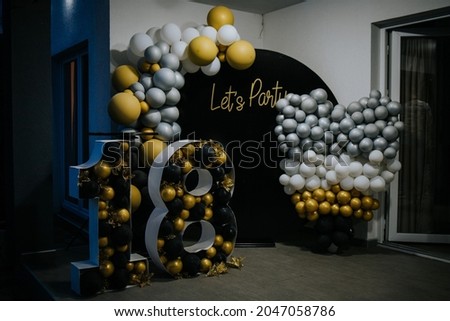 A room with eighteenth birthday party decorations
