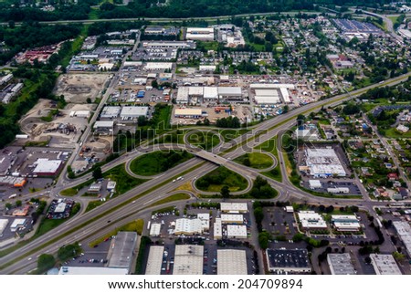 Beautiful Aerial View of the Pacific Northwestern City of Seattle, Washington, USA.  Clover-leaf on Freeway.