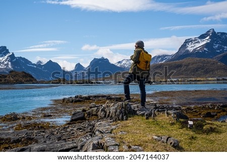 Traveler photographer beautiful mountain and fjord places