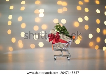 Christmas gift in a supermarket mini trolley