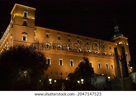 the Alcazar illuminated at night, historic monumental building in the city of toledo, spain