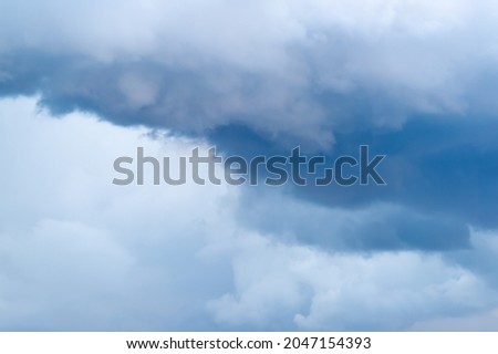 Cumulus clouds before a thunderstorm, storm. Background with white clouds floating above the ground at flight altitude. Picture for weather forecast. 