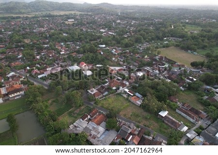 aerial photos of rural areas, there are rice fields and residential areas. rice fields to grow rice, the staple food for most Indonesians.