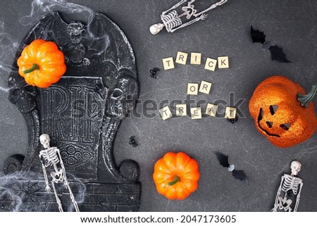 Halloween decorations on black background. Halloween concept. Flat lay, top view. Trick or treat.