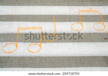 Musical notes creatively drawn on a crosswalk