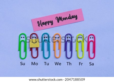 Cool wallpaper that says "Happy Monday" with colorful paper clips and smiling expressions.