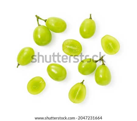 A lot of Shine-Muscat grapes and cut Shine-Muscat grapes on a white background. White grapes.  Japanese grapes. View from above Royalty-Free Stock Photo #2047231664