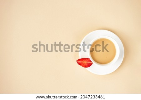 Autumn flat lay background on yellow. Composition with realistic red leaves and cup of coffee. Hello october concept