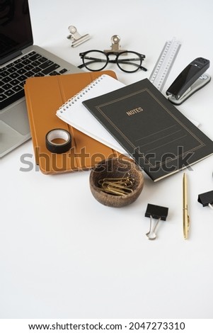 Aesthetic home office desk workspace with laptop computer, notebook, tabled pad on white background. Blog, website, social media concept.