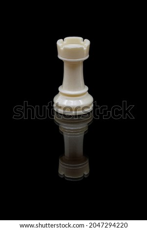 White rook chess piece on black background casting reflection Royalty-Free Stock Photo #2047294220
