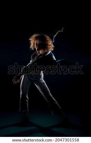 Contemporary dancing performer in a dance practice class