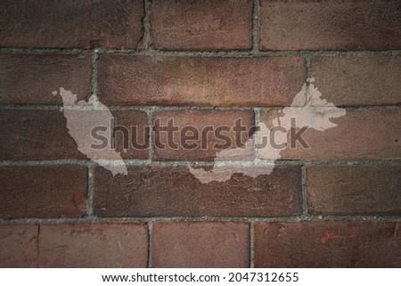 painted map of malaysia on a old brick wall