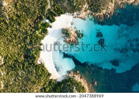 View from above, stunning aerial view of a green coast with the beautiful Prince Beach (Spiaggia del Principe) a white sand beach bathed by a turquoise water. Sardinia, Italy. Royalty-Free Stock Photo #2047388969