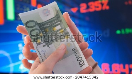 Counting euro bills in the stock market. Investors counting money after making it big on the stock market. becoming rich and wealthy. online stock market information. Trading report for business conce