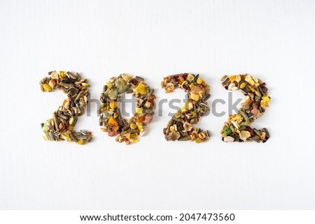 Number 2022 made of animal food isolated on white background. Happy New Year or Christmas for animals concept.