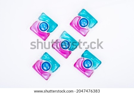 Multicolored capsules with gel for washing clothes and dishes. Studio Photo
