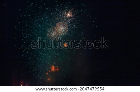 Holiday fireworks backgrounds with sparks, colored stars and bright nebula on black night sky universe, comets. Amazing beauty colorful fireworks display on celebration, showing. Holidays backgrounds