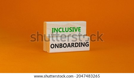 Inclusive recruiting symbol. Wooden blocks with words Inclusive recruiting on beautiful orange background. Business, HR and inclusive recruiting concept. Copy space.