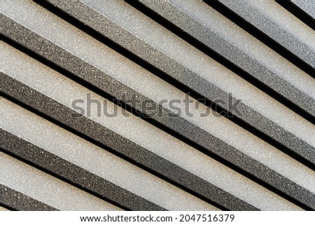 BEAUTIFUL BACKGROUND OF DARK GRAY AND LIGHT GRAY STRIPES LOCATED DIAGONALLY
