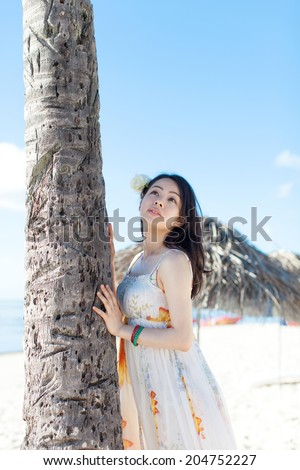 beautiful young woman on the tropical island beach