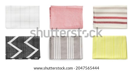 Set with different clean kitchen towels on white background, top view. Banner design