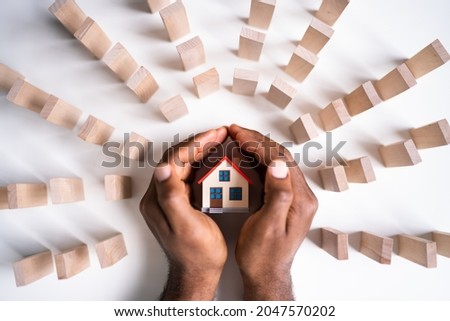 Real Estate House Insurance. Domino Chain Challenge And Risk Protection Royalty-Free Stock Photo #2047570202
