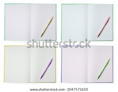 Set with open planners on white background, top view