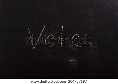 vote sign on blackboard