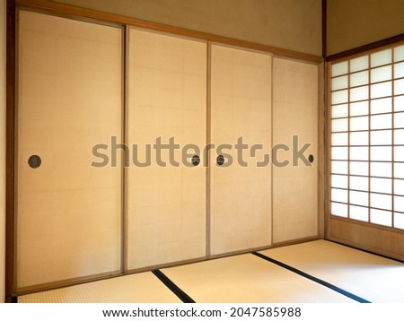 Japanese-style tatami floor and sliding doors Royalty-Free Stock Photo #2047585988