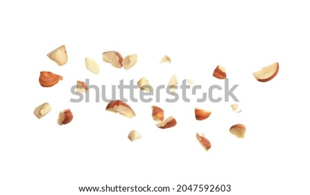 Pieces of tasty hazelnuts on white background Royalty-Free Stock Photo #2047592603