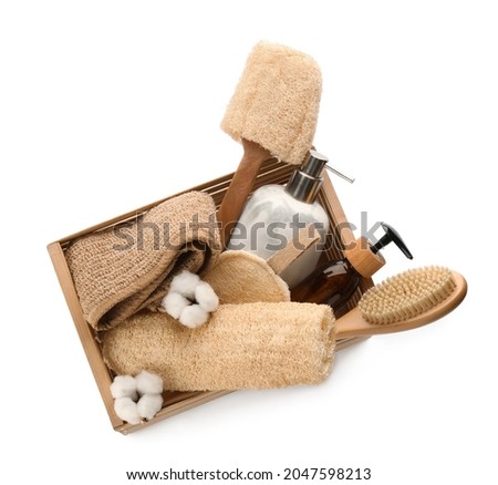 Set of toiletries with natural loofah sponges in wooden crate isolated on white, top view Royalty-Free Stock Photo #2047598213