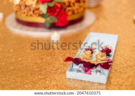 Red and gold festive decoration. flowers, food on the birthday table. Wedding table. Festive background