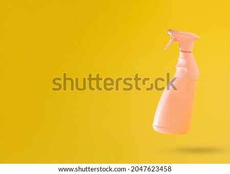 Creative marketing idea. Pink window cleaner against yellow background with copy space. Advertisement idea. Minimal banner ad concept. Abstract 3D Background Art.
