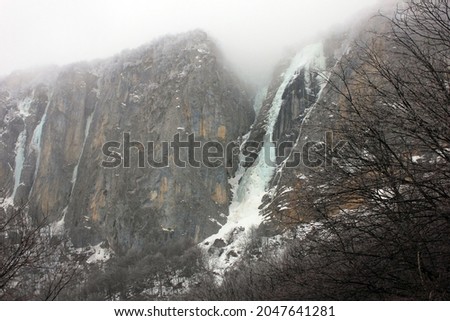 Frozen waterfall in the mountains. The village of Gryzdakhnya. Guba region. Azerbaijan.