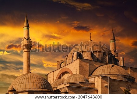 Beautiful historical Selimiye Mosque | Sultan Selim Camii in front of dramatic sunset in Konya, Turkey. Royalty-Free Stock Photo #2047643600