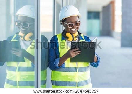 Adult female builder, engineer, architect, inspector, manager at construction site. Woman with plan, clip board. Portrait of smart female engineer inspector hand hold paper chart inventory checking